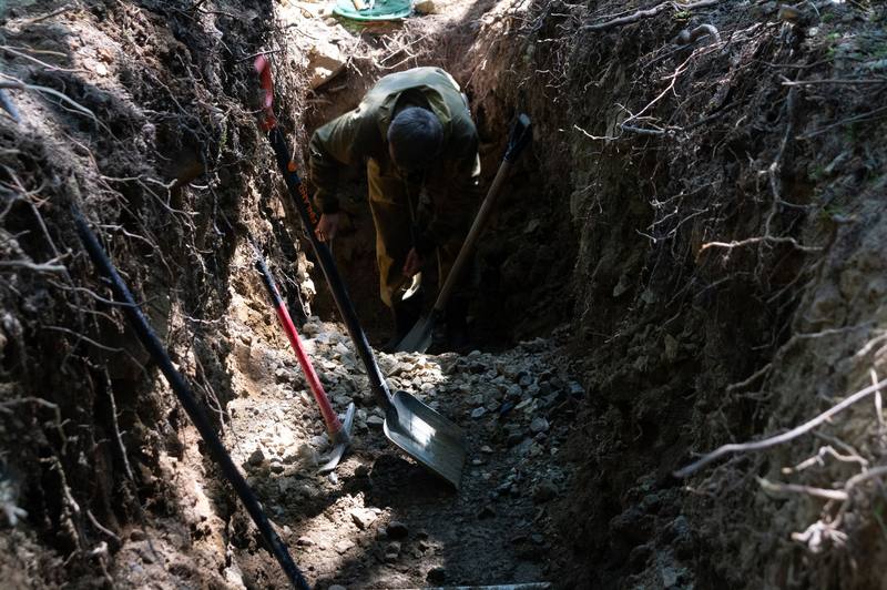 landscaping crew digging trench - Roseville French Drain